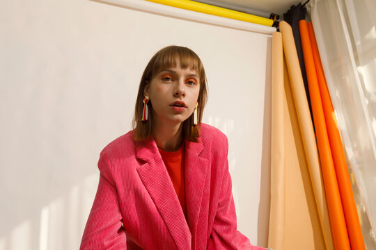 Young Woman Poses in Vibrant Cropped Top Showcasing Unique Pattern