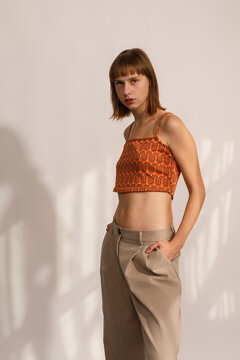 Model Showcases Stylish Outfit in Modern Studio Setting