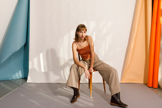 Fashion Model Poses on Chair 