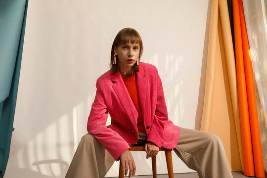 Model Poses in Bright Pink Blazer 