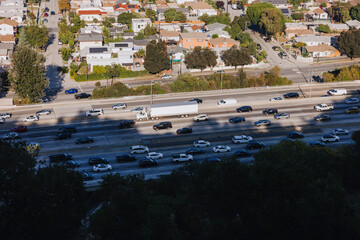 Traffic Flow on Busy Highway With Cityscape View in the Background