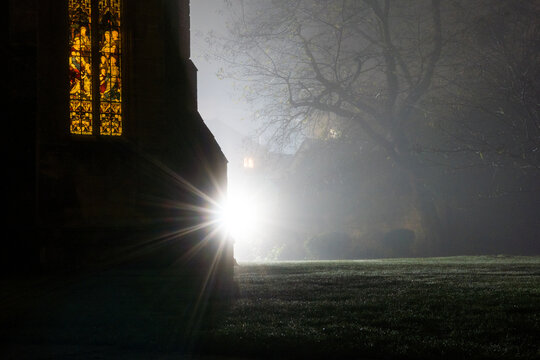 Historic abbey grounds illuminated at night