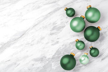 Luxury christmas ball ornaments on white marble background, copy space
