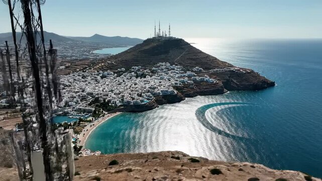 Telecommunication towers on a coastal area with a small village