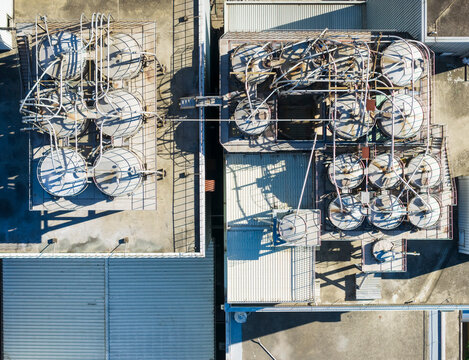 Aerial View of Industrial Tanks and Rooftop Pipework Facility