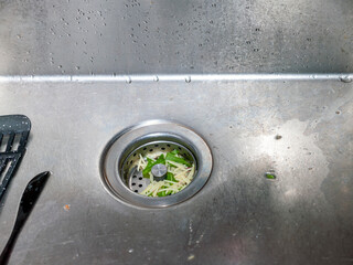 sink clogged with noodles