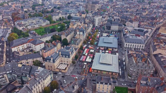 Place des Lices public square during market day with basilique Saint-Aubin en Notre-Dame-de-Bonne-Nouvelle in background from above, Rennes, Ille-et-Vilaine, France