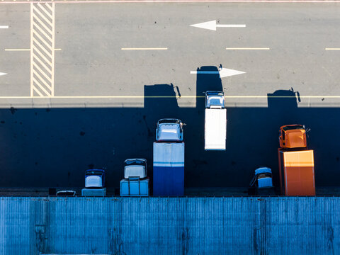 Aerial View of Small Truck Exiting Logistics Warehouse