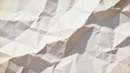 Close-up of crumpled white paper with textured folds and shadows