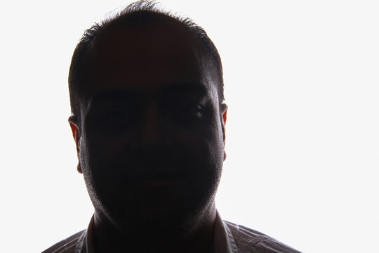 Portrait of a middle-aged Iranian man in a white background with studio lighting
