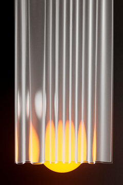 3D render of glowing sphere near curtains and black metallic bal