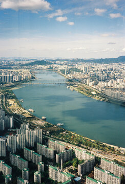 Aerial view of Seoul cityscape with Han River and bridges
