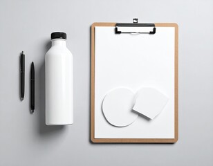 Top-down office essentials arrangement on gray backdrop