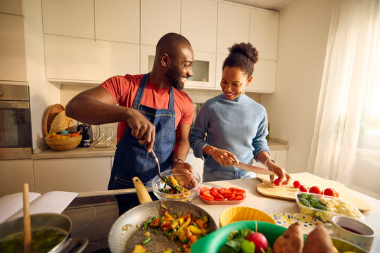 Man and woman enjoy cooking together