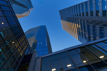Reflective Glass Facade with Warm Tower Highlights
