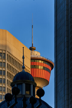 Calgary Tower Framed by Downtown Architecture
