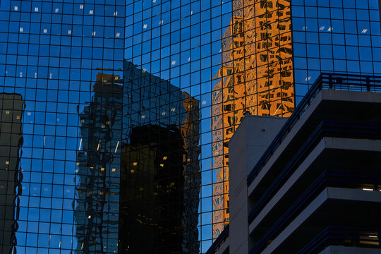 Reflective Glass Facade with Warm Tower Highlights
