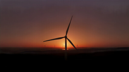 Wind turbines generating power at sunrise landscape.