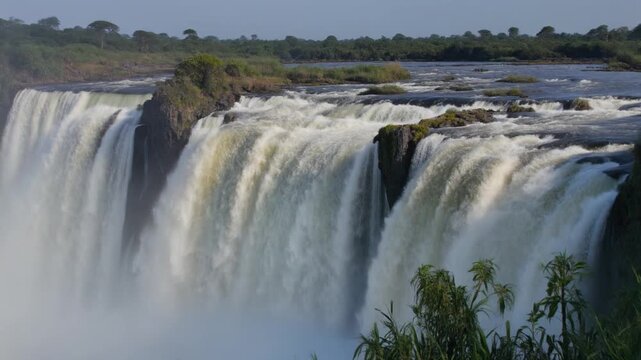 Victoria Falls Landscape with Water Cascading Down Rocks.