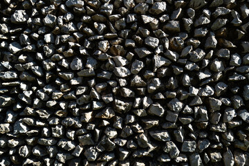 Old stone background with rustic texture. Historic stone wall background in architecture. Aged stone surface as background. Textured old stone blocks background.