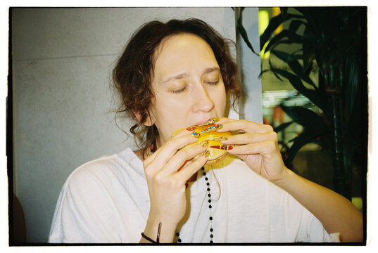 Enjoying a tasty burger at a lively restaurant in the city