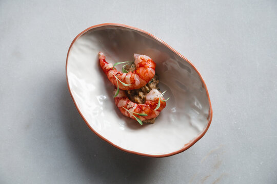 A display of elegantly plated king prawns