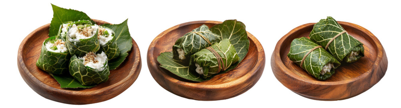Set of Lu Pulu beef wraps filled with coconut cream in taro leaves on wooden plate, isolated on white transparent background