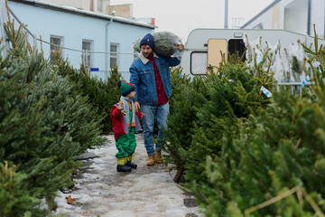 Father and Son Choosing Christmas Tree Together