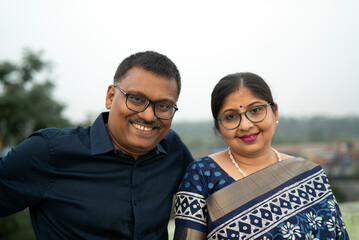 Indian Middle aged couple making interaction at outdoors and happy 