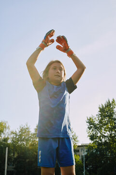 Young soccer player practicing goalkeeping skills