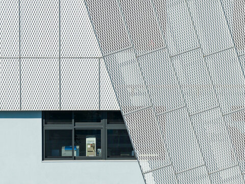 Modern Building Facade with White Mesh Metal Cladding