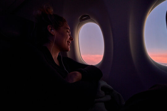 Passenger Looking Out Airplane Window
