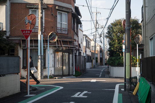 Quiet Residential Alley with Overhead Wires in Tokyo