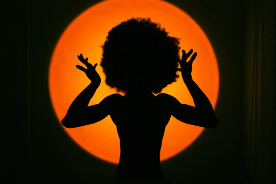 Silhouette Under Intense Spotlight