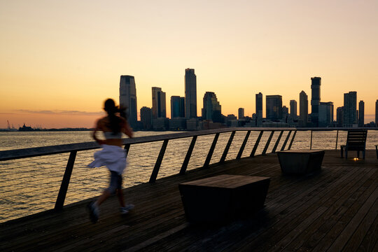 Woman Running NYC at Sunset in the city