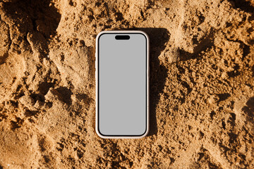 phone Mockup with Blank Screen on Sandy Surface