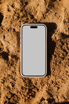 Phone Mockup Featuring Blank Display in Sand