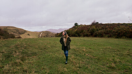 Woman in the middle of a field in a rural area