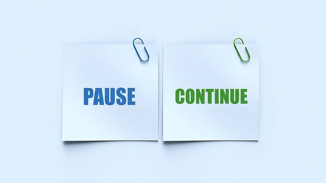 Pause and continue options displayed on contrasting white note cards with clips