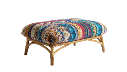 Bohemian handwoven rattan ottoman with colorful textile top isolated on solid white background1