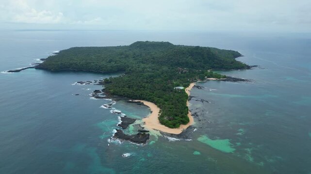 Aerial view from Ilheu das Rolas,known worldwide because the equator marker is located in this place. Drone shot backwards.