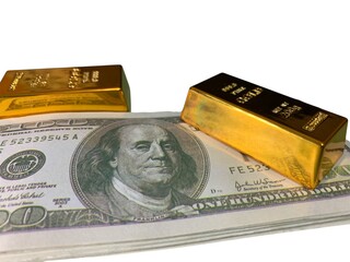 Two gold bars positioned on a stack of U.S. hundred-dollar bills, highlighting luxury and financial security © MR HEPPY