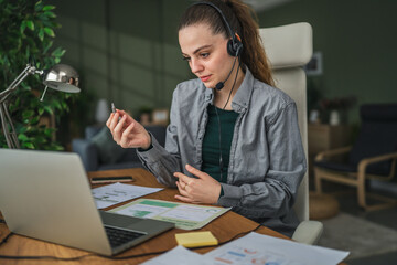 Woman communicating using sign language during video call