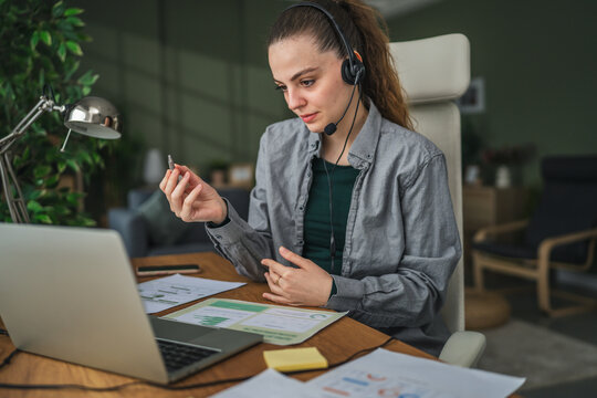 Woman communicating using sign language during video call