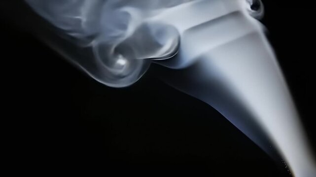 Elegant Swirling White Smoke Wisps Against a Stark Black Background with Dramatic Lighting Creating a Mystical and Ethereal Atmosphere