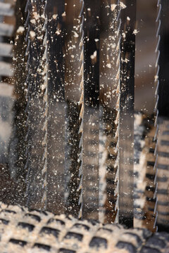 Close up of wood shavings flying from old gate saw in Upper Bavaria