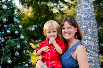 Happy aunty cuddles with her nephew together at Christmas in Australia