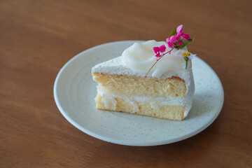 coconut cake in white ceramic plate on wooden floor background, dessert, food, fashion, decor, object, snack, copy space