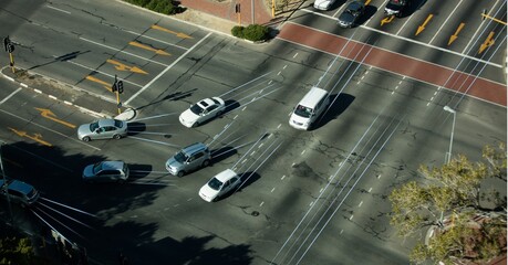 Composition of network of light trails and connections over road traffic and cityscape