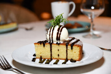cupcake, sponge cake with chocolate and cream on a plate